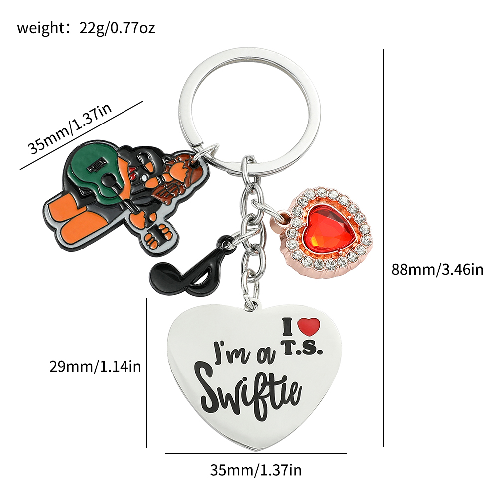 Breloczek Taylor dla fanów, ko – Women Accessories Holder recenzja i cena